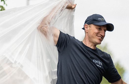 A member of the 10 to 90 team recycling